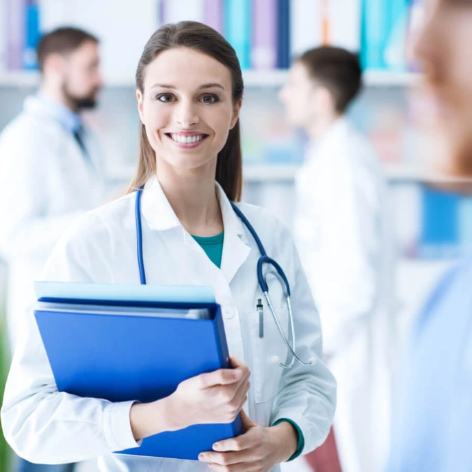 Female doctor smiling in clinic, providing medical services